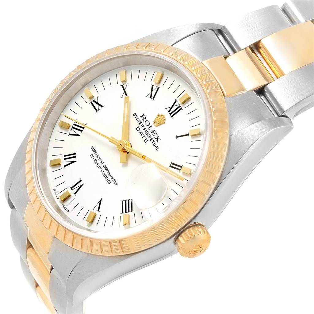 This image shows a tilted view of a Rolex Date 15223 Men's Steel and Gold (two tone) White Dial 15223 Men's Steel and Gold (two tone) White Dial featuring the face, bezel, crown, and part of the bracelet.