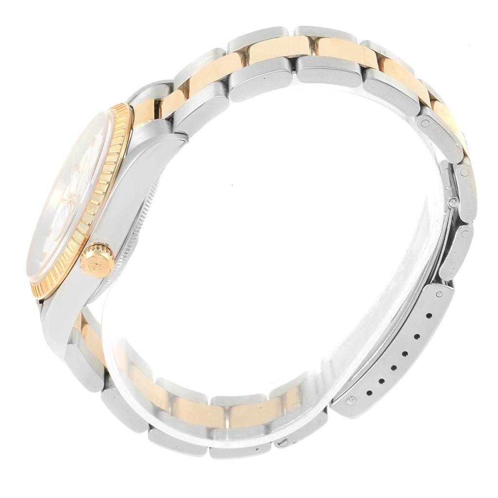This image shows the side view of a Rolex Date 15223 Men's Steel and Gold (two tone) White Dial 15223 Men's Steel and Gold (two tone) White Dial model watch, highlighting its bracelet, crown, and case.