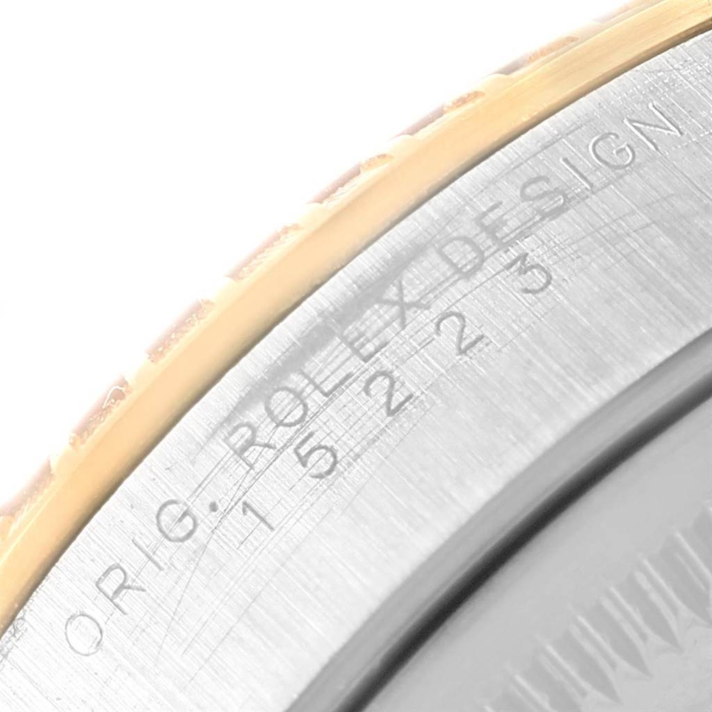 The image shows an up-close view of the bezel and case side of a Rolex Date 15223 Men's Steel and Gold (two tone) White Dial 15223 Men's Steel and Gold (two tone) White Dial model watch.