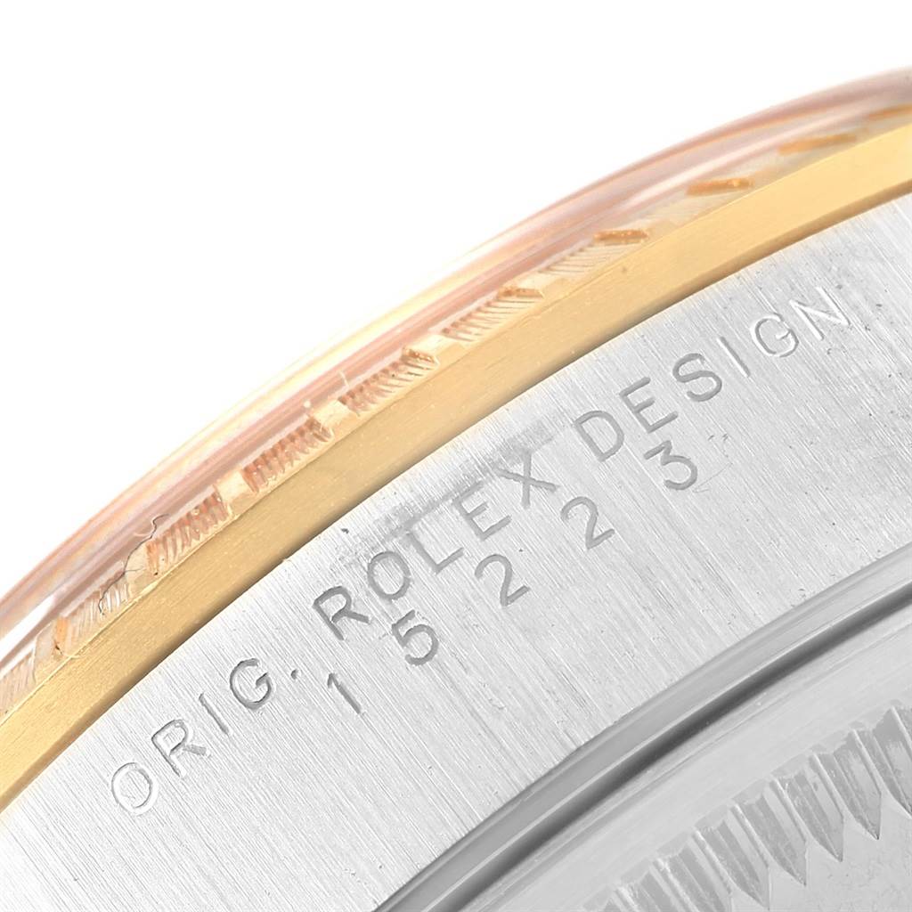 This close-up image shows the engraved side of a Rolex Date 15223 Men's Steel and Gold (two tone) White Dial 15223 Men's Steel and Gold (two tone) White Dial model watch case, highlighting the case's edge and reference number.