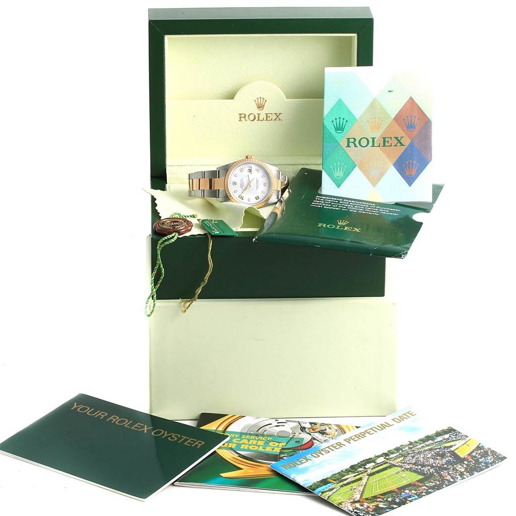 The image shows a Rolex Date 15223 Men's Steel and Gold (two tone) White Dial 15223 Men's Steel and Gold (two tone) White Dial model watch in its opened green box, along with various booklets and accessories.