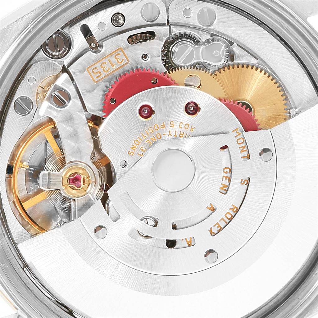 This image shows the internal mechanism of a Rolex Date 15223 Men's Steel and Gold (two tone) White Dial 15223 Men's Steel and Gold (two tone) White Dial model watch at a close-up angle, highlighting its gears and rotors.