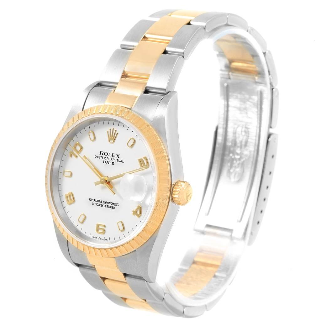 The image shows a gold and silver Rolex Date 15223 Men's Steel and Gold (two tone) White Dial 15223 Men's Steel and Gold (two tone) White Dial model watch from an angled side view, highlighting the face, bezel, crown, and bracelet.