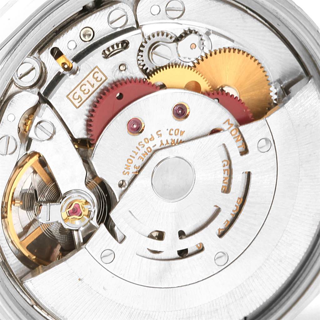 The image shows the internal mechanics of a Rolex Date 15200 Men's Stainless Steel Silver Dial 15200 Men's Stainless Steel Silver Dial model watch, highlighting gears and movement components.