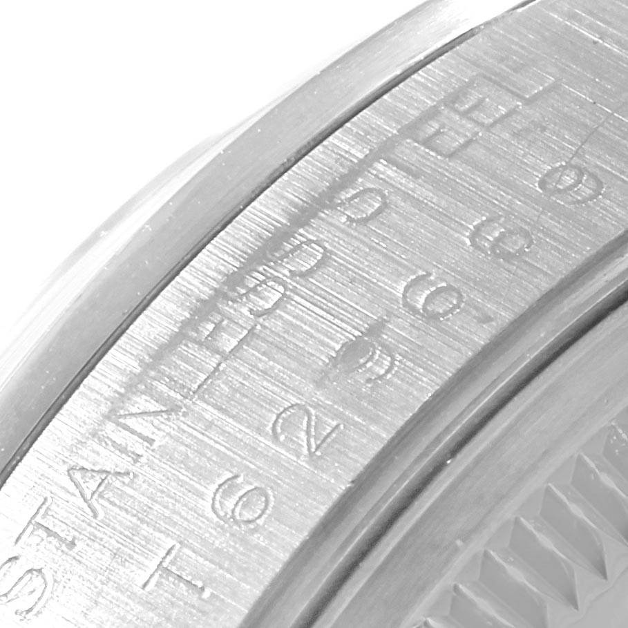 The image shows a close-up of the engraving on the bezel of a Rolex Date 15200 Men's Stainless Steel Silver Dial 15200 Men's Stainless Steel Silver Dial model watch.