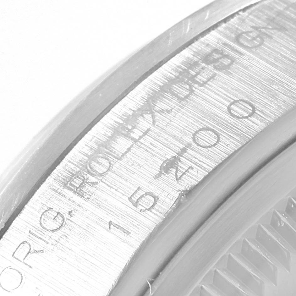 This close-up image shows part of the bezel and engraved text from a Rolex Date 15200 Men's Stainless Steel Silver Dial 15200 Men's Stainless Steel Silver Dial model watch.