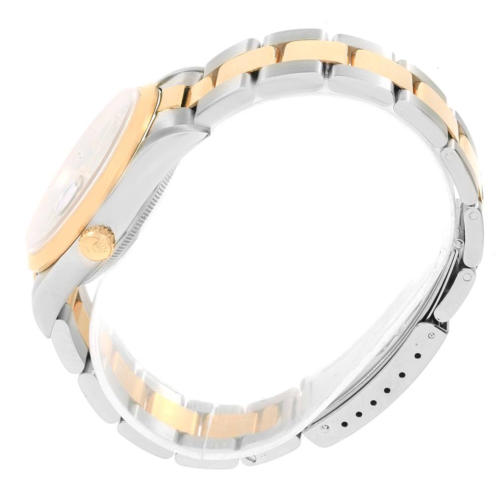 This image shows a side view of a Rolex Date 15203 Men's Steel and Gold (two tone) Black Dial 15203 Men's Steel and Gold (two tone) Black Dial watch, highlighting the gold crown, bezel, and two-tone bracelet.