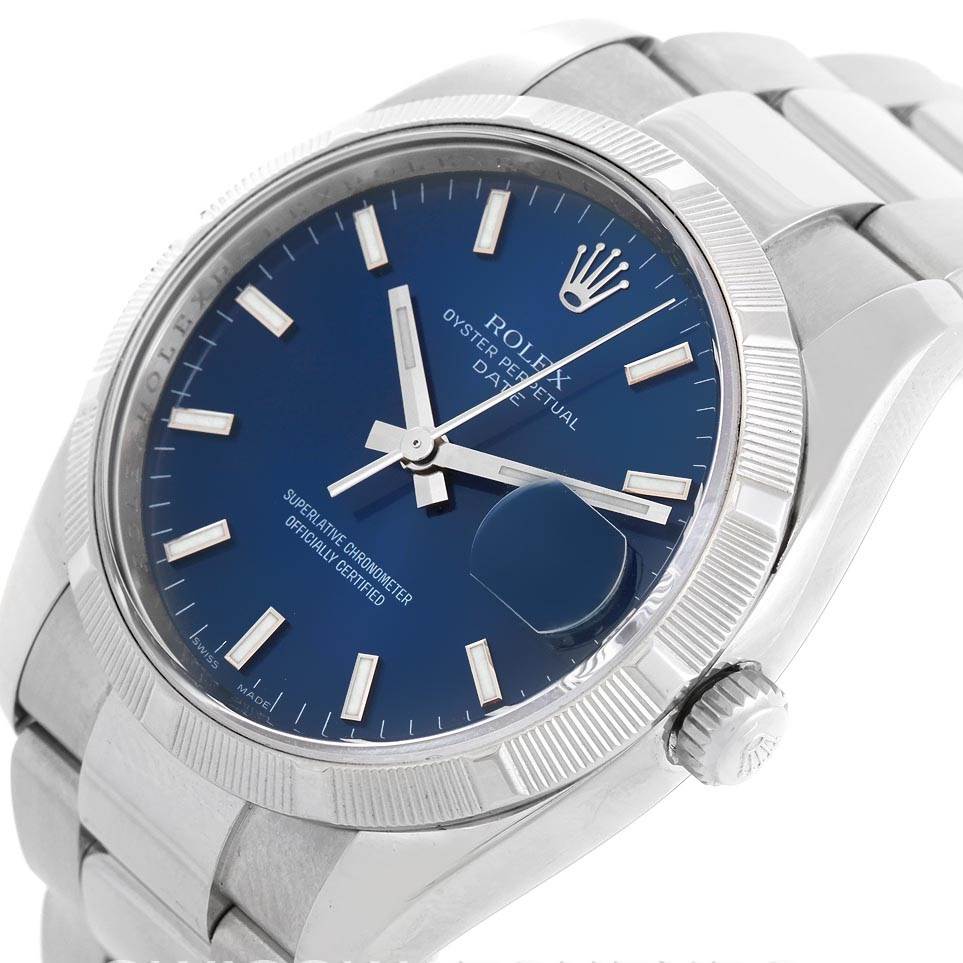 The image shows a close-up, angled view of the Rolex Date 115210 Men's Stainless Steel Blue Dial 115210 Men's Stainless Steel Blue Dial watch's face, bezel, crown, and part of its bracelet.
