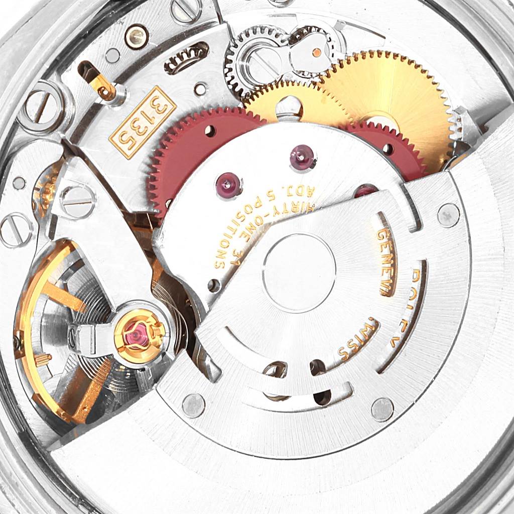 This image shows the inner mechanical movement of a Rolex Date 115210 Men's Stainless Steel Blue Dial 115210 Men's Stainless Steel Blue Dial model watch from a top-down perspective.