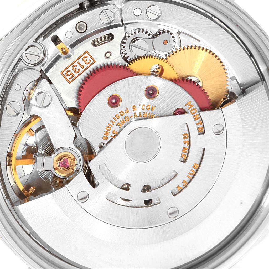 This image shows the inner movement mechanism of a Rolex Date 15223 Men's Steel and Gold (two tone) Champagne Dial 15223 Men's Steel and Gold (two tone) Champagne Dial model watch, focusing on the gears and rotor.