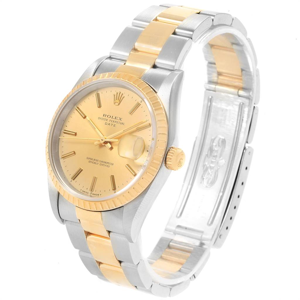 The Rolex Date 15223 Men's Steel and Gold (two tone) Champagne Dial 15223 Men's Steel and Gold (two tone) Champagne Dial model watch is shown from an angled perspective, highlighting its dial, fluted bezel, and two-tone bracelet.