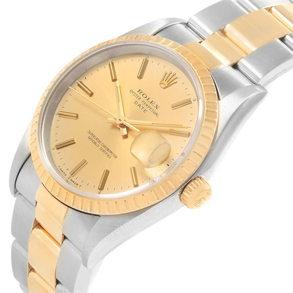 This Rolex Date 15223 Men's Steel and Gold (two tone) Champagne Dial 15223 Men's Steel and Gold (two tone) Champagne Dial watch is shown at a slight angle, highlighting its gold dial, bezel, crown, and two-tone bracelet.