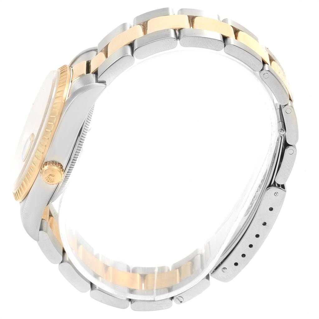 The image shows a side view of a Rolex Date 15223 Men's Steel and Gold (two tone) Champagne Dial 15223 Men's Steel and Gold (two tone) Champagne Dial model watch, highlighting the case, crown, and two-tone bracelet.