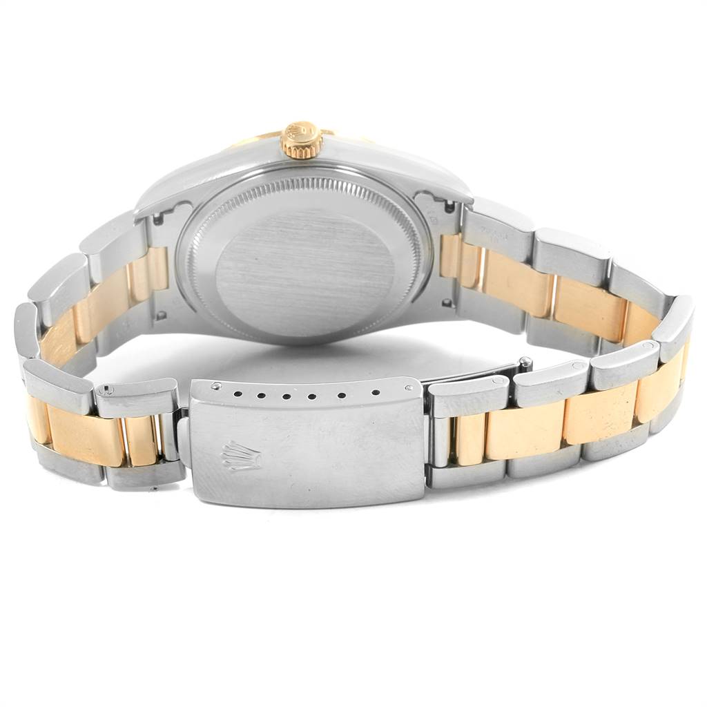 This image shows the back view of a Rolex Date 15223 Men's Steel and Gold (two tone) Champagne Dial 15223 Men's Steel and Gold (two tone) Champagne Dial model watch, focusing on the case back and the bracelet clasp.