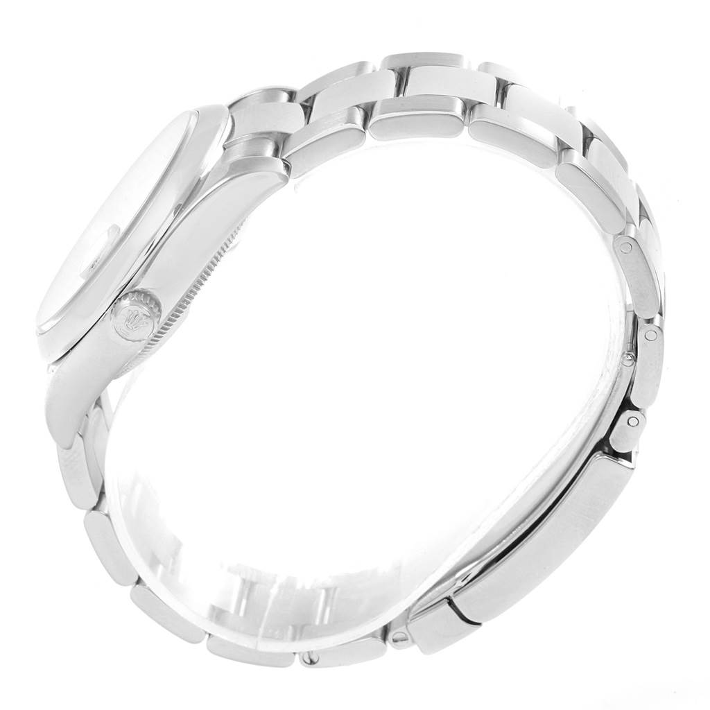 This side-view angle shows the case, crown, and bracelet of the Rolex Date 115200 Men's Stainless Steel Silver Dial 115200 Men's Stainless Steel Silver Dial model watch.