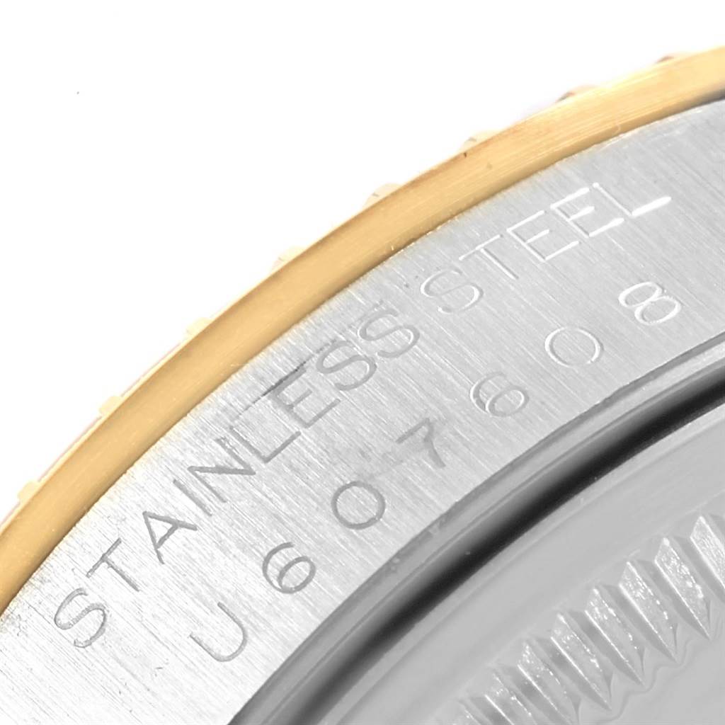This close-up image shows the engraved stainless steel back casing of a Rolex Date 15223 Men's Steel and Gold (two tone) Grey Dial 15223 Men's Steel and Gold (two tone) Grey Dial model watch.