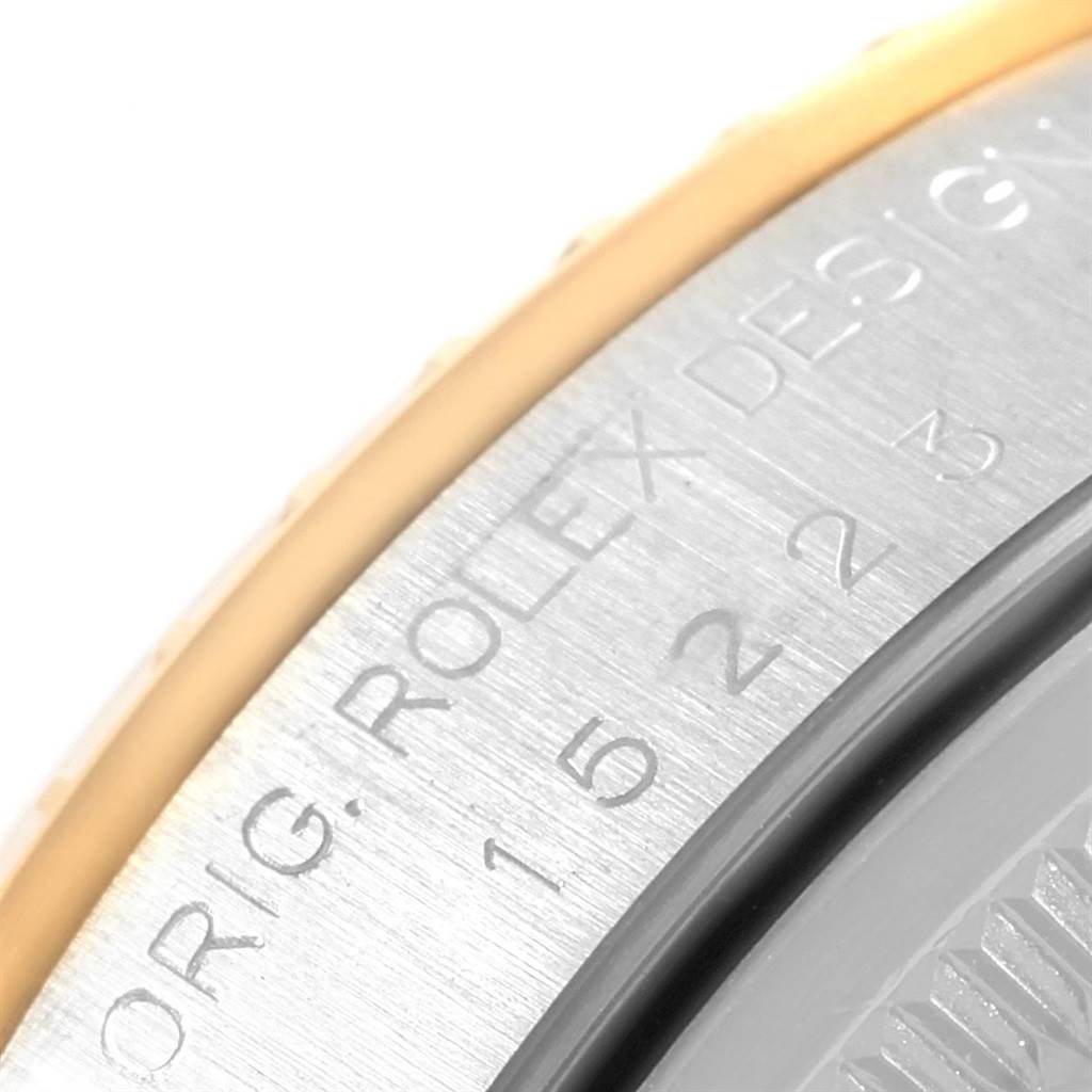 This close-up image shows the engraved case back of a Rolex Date 15223 Men's Steel and Gold (two tone) Grey Dial 15223 Men's Steel and Gold (two tone) Grey Dial model watch.