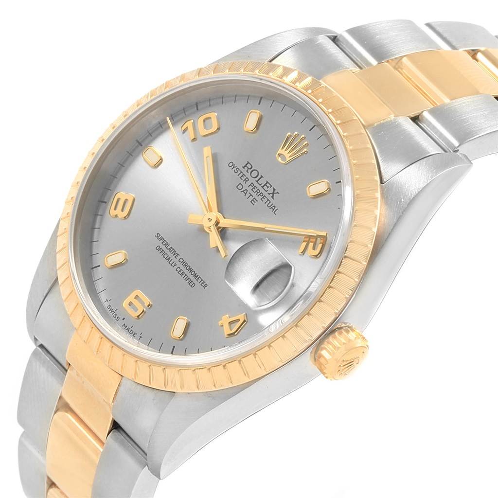 The image shows a close-up angled view of a Rolex Date 15223 Men's Steel and Gold (two tone) Grey Dial 15223 Men's Steel and Gold (two tone) Grey Dial model watch, featuring the dial, bezel, case, crown, and part of the bracelet.