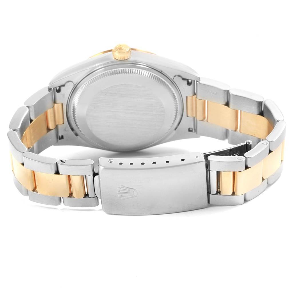 This image shows the back case and clasp of a Rolex Date 15223 Men's Steel and Gold (two tone) Grey Dial 15223 Men's Steel and Gold (two tone) Grey Dial model watch.