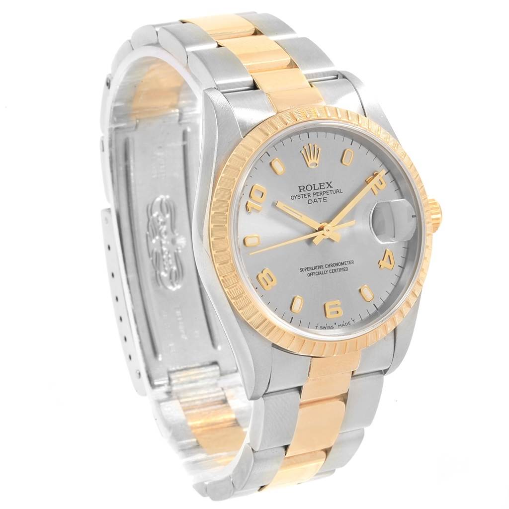 This Rolex Date 15223 Men's Steel and Gold (two tone) Grey Dial 15223 Men's Steel and Gold (two tone) Grey Dial model watch is shown from an angled front view, highlighting the face, bezel, and two-tone bracelet.