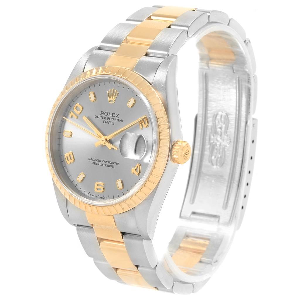 This image shows a Rolex Date 15223 Men's Steel and Gold (two tone) Grey Dial 15223 Men's Steel and Gold (two tone) Grey Dial model watch from an angled view, displaying its dial, bezel, and two-tone bracelet.