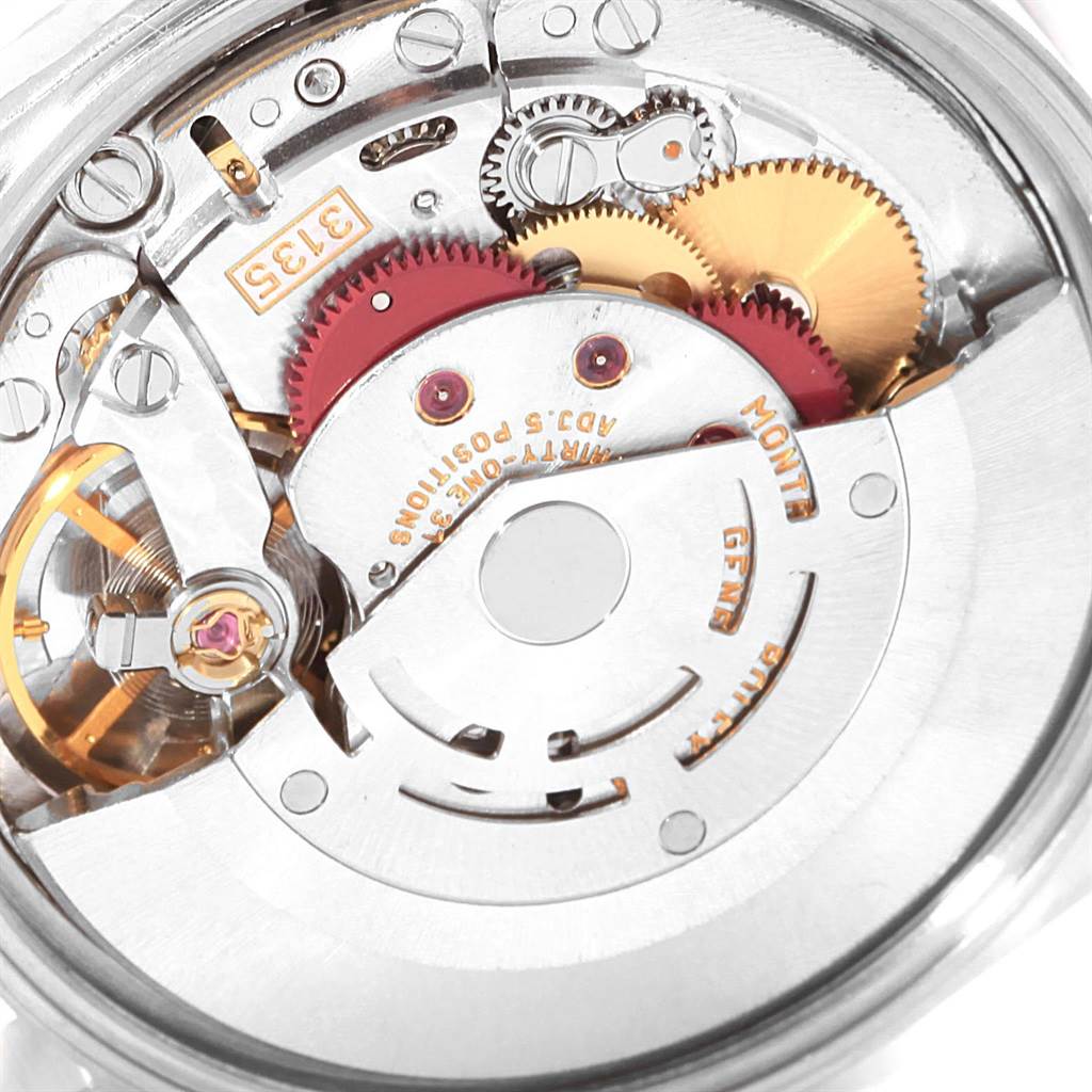 The image shows the movement mechanism of a Rolex Date 15210 Men's Stainless Steel Black Dial 15210 Men's Stainless Steel Black Dial model watch from a rear angle, highlighting gears and components.