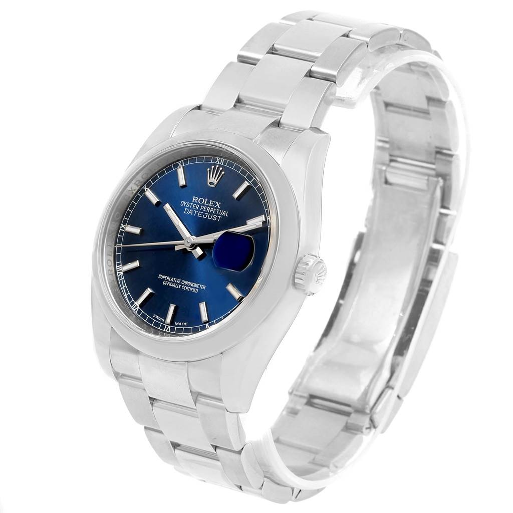The Rolex Date 116200 Men's Stainless Steel Blue Dial 116200 Men's Stainless Steel Blue Dialjust shown is angled slightly to the left, revealing the blue dial, case, bracelet, and partially obscured date magnifier.