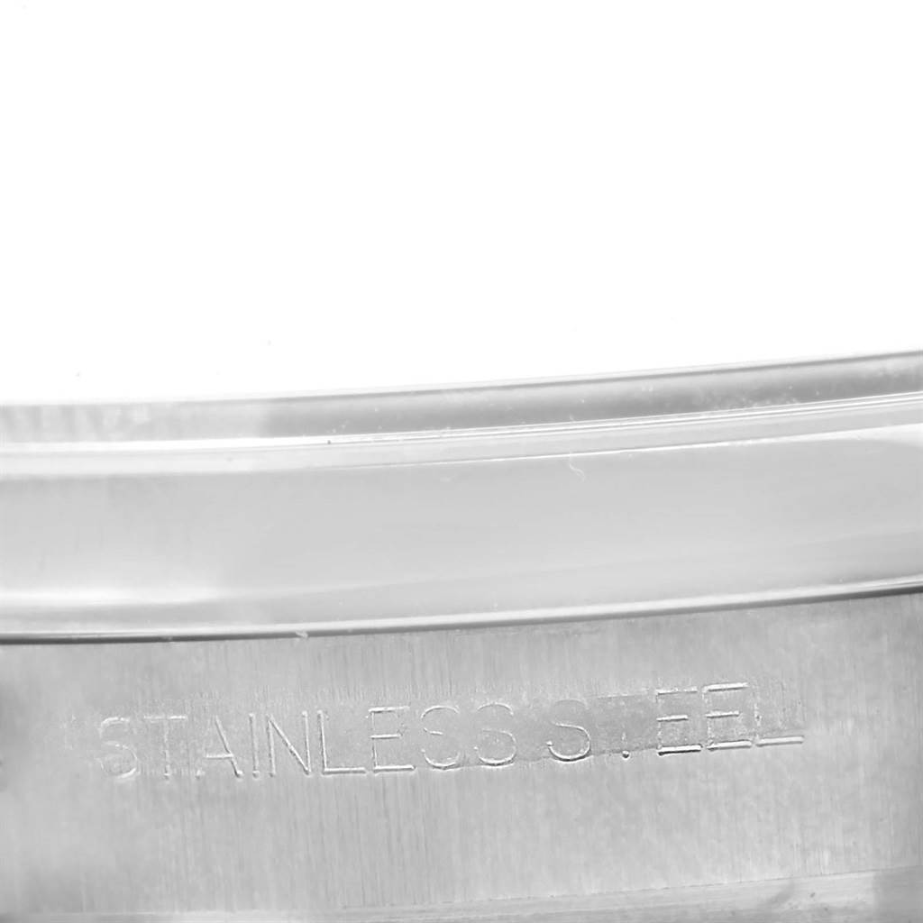 The close-up image shows the stainless steel part of a Rolex Date 116200 Men's Stainless Steel Blue Dial 116200 Men's Stainless Steel Blue Dial model watch.