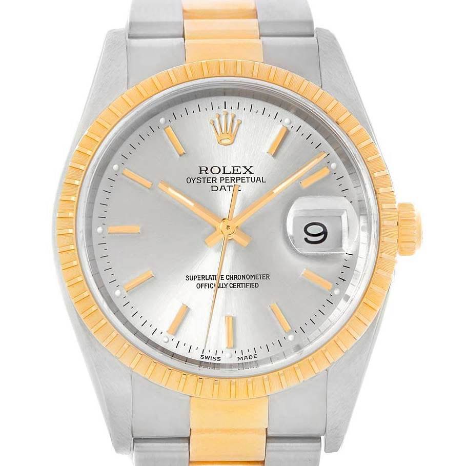 The Rolex Date 15223 Men's Steel and Gold (two tone) Silver Dial 15223 Men's Steel and Gold (two tone) Silver Dial watch is shown from a front angle, displaying the dial, hour markers, hands, and the date window.