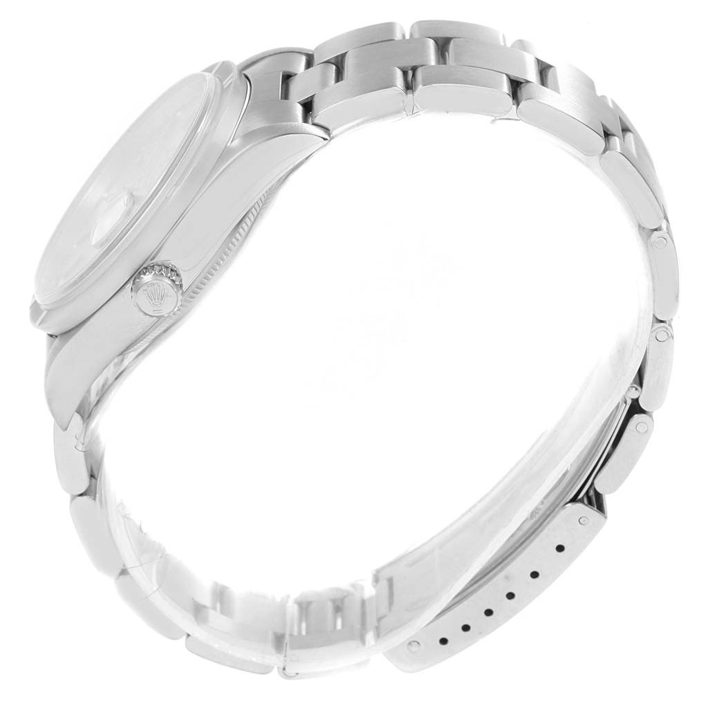 The image shows a side view of the Rolex Date 15210 Men's Stainless Steel Silver Dial 15210 Men's Stainless Steel Silver Dial model watch, highlighting the crown, bezel, and bracelet.