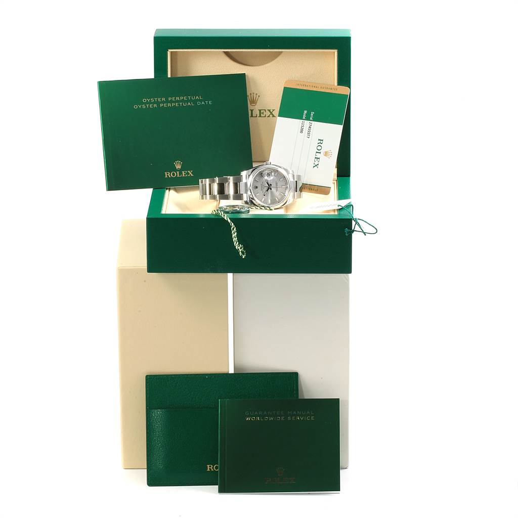 This image shows a Rolex Date 115200 Men's Stainless Steel Silver Dial 115200 Men's Stainless Steel Silver Dial model watch with its accessories, including booklets and the original box, from a frontal angle.