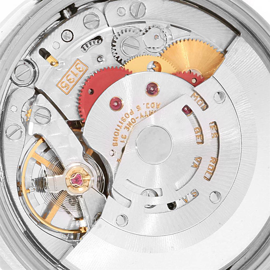 This close-up shows the internal mechanism of a Rolex Date 15210 Men's Stainless Steel White Dial 15210 Men's Stainless Steel White Dial model watch, highlighting gears and components from the movement.