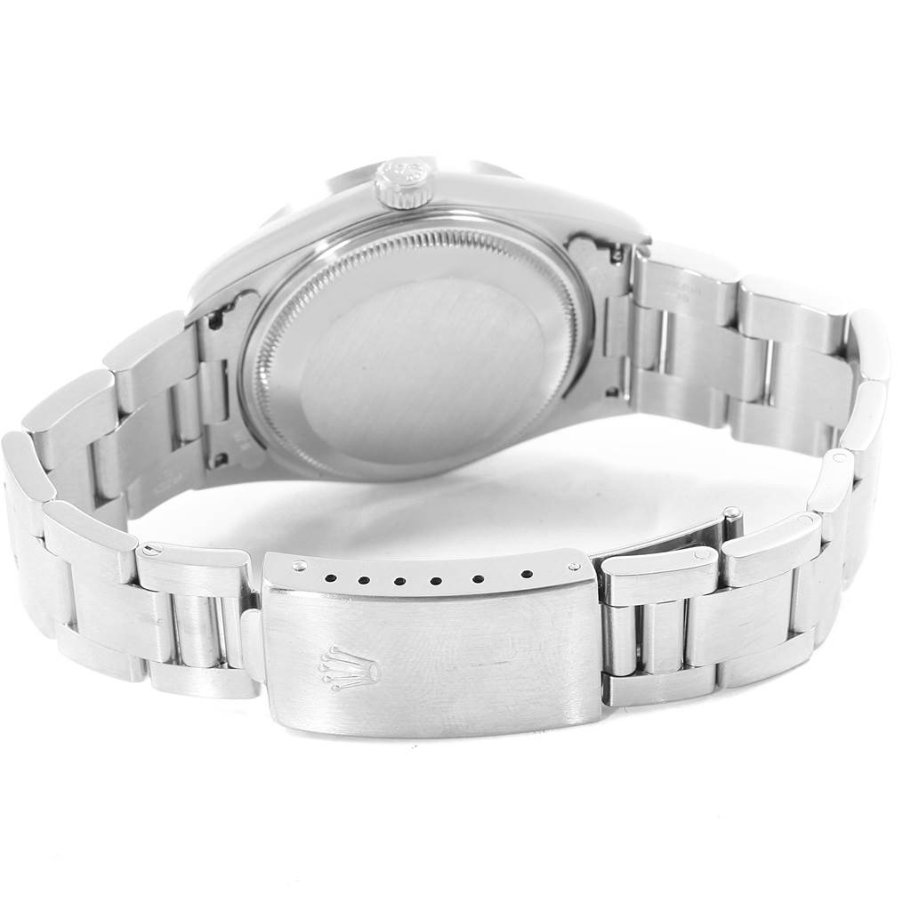 The image shows the back side of the Rolex Date 15210 Men's Stainless Steel Silver Dial 15210 Men's Stainless Steel Silver Dial model watch, focusing on the case back and bracelet with the clasp.