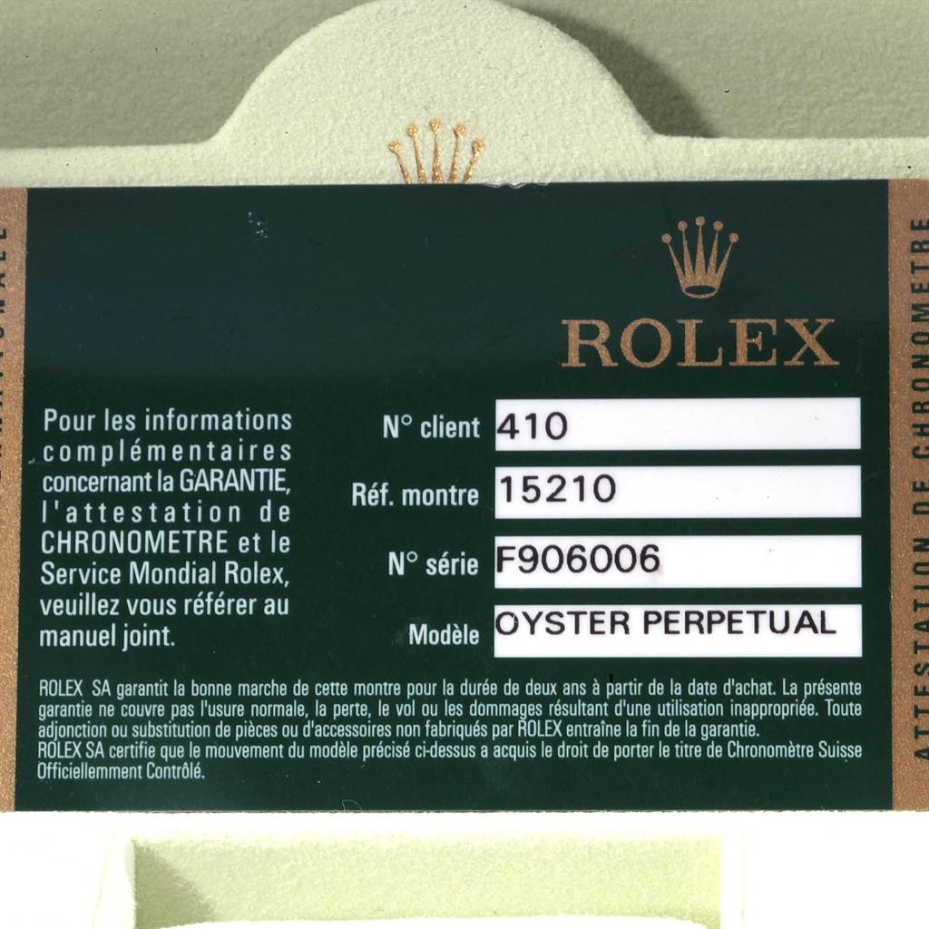 This image shows the warranty card for a Rolex Oyster Perpetual Date model, including reference, client, and serial numbers.