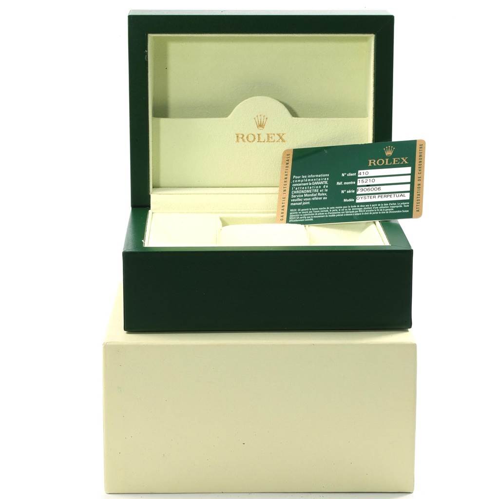 The image shows the green box and warranty card for a Rolex Date 15210 Men's Stainless Steel Silver Dial 15210 Men's Stainless Steel Silver Dial model watch, viewed from the front.