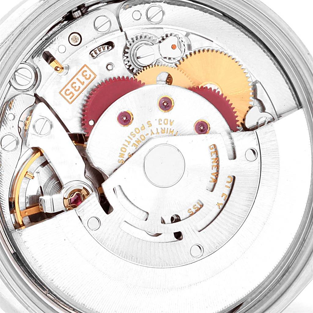 This image shows the internal mechanism of a Rolex Date 15210 Men's Stainless Steel Silver Dial 15210 Men's Stainless Steel Silver Dial model watch, including gears and the rotor.