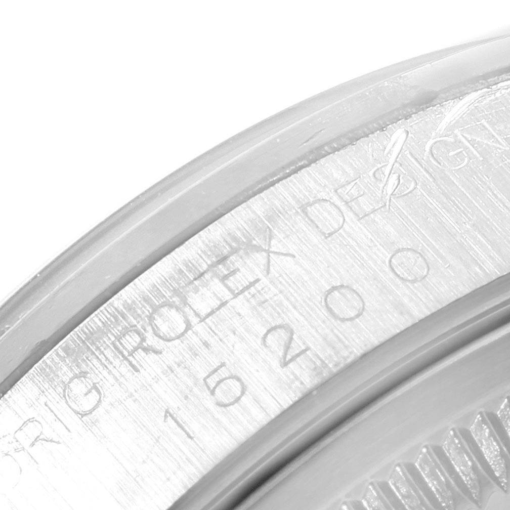 The image shows a close-up of the case back edge of a Rolex Date 15200 Men's Stainless Steel Blue Dial 15200 Men's Stainless Steel Blue Dial model watch, revealing engraved details and numbers.
