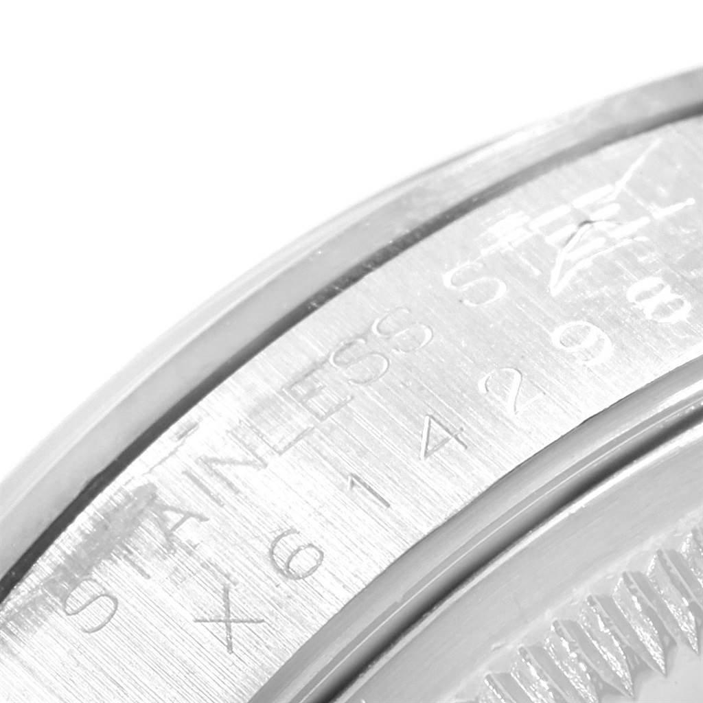 The image shows a close-up of the outer engraving detail on the bezel of a Rolex Date 15200 Men's Stainless Steel Blue Dial 15200 Men's Stainless Steel Blue Dial model watch.