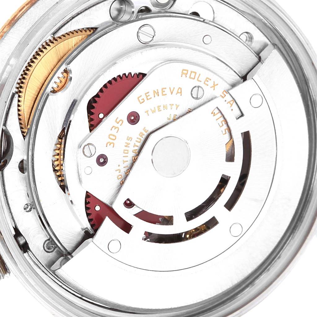 The image shows a close-up of the movement mechanism of a Rolex Date 15053 Men's Steel and Gold (two tone) White Dial 15053 Men's Steel and Gold (two tone) White Dial model, featuring gears and the rotor.