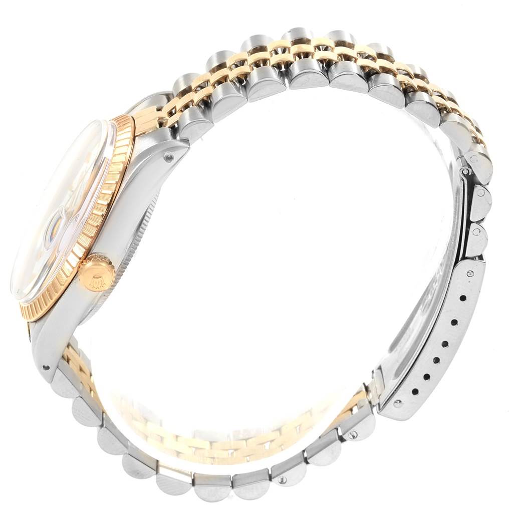 The image shows a side view of a Rolex Date 15053 Men's Steel and Gold (two tone) White Dial 15053 Men's Steel and Gold (two tone) White Dial model watch highlighting the case, crown, and bi-metal bracelet.