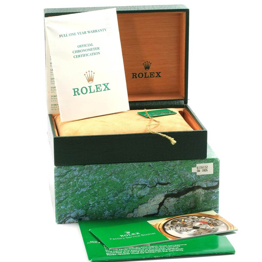 The image shows the packaging and accessories of a Rolex Date 15210 Men's Stainless Steel Black Dial 15210 Men's Stainless Steel Black Dial model, including the box, warranty card, and official chronometer certification.