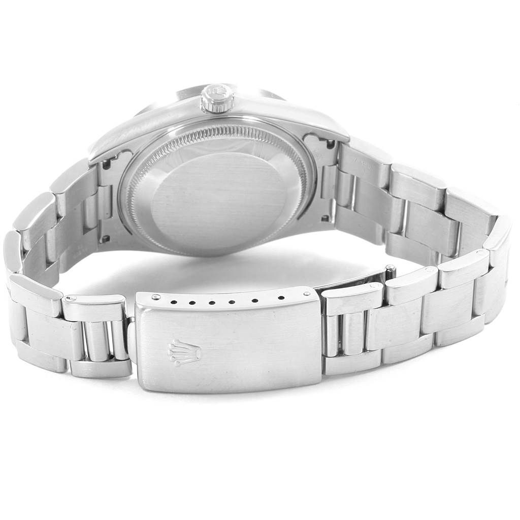 The image shows the back case and bracelet clasp of a Rolex Date 15210 Men's Stainless Steel Black Dial 15210 Men's Stainless Steel Black Dial model watch in a partially open position.