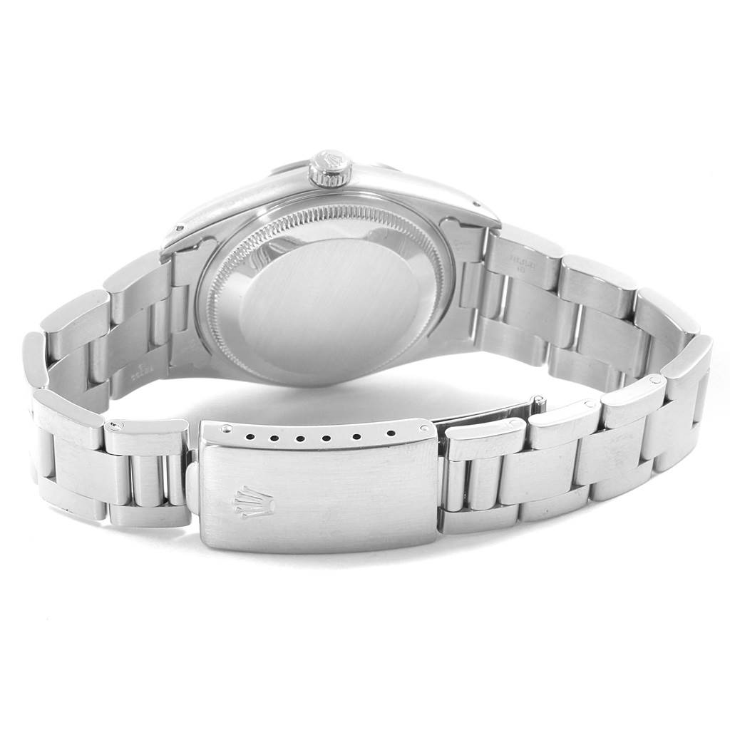 The image shows the back case, crown, and bracelet clasp of a Rolex Date 15200 Men's Stainless Steel Black Dial 15200 Men's Stainless Steel Black Dial model watch from a rear angle.