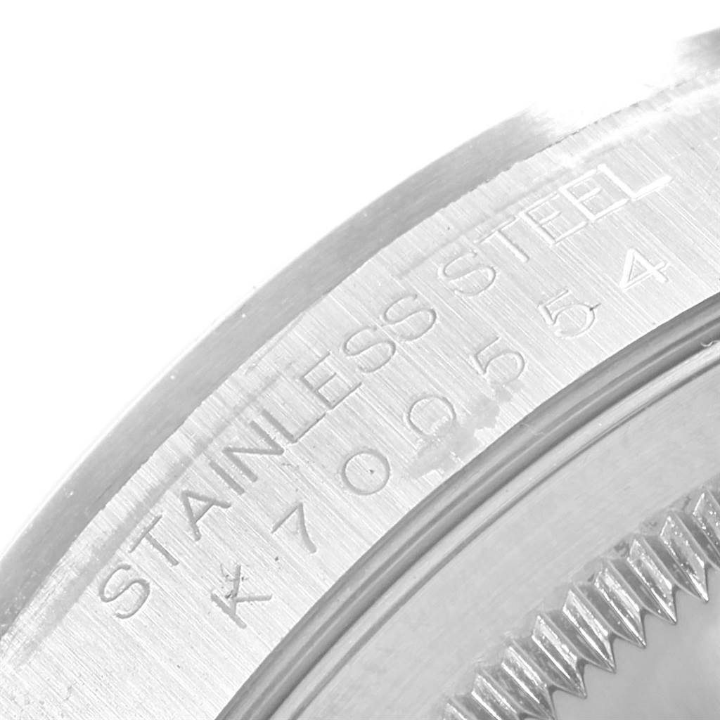 The image shows a close-up of the serial number and stainless steel marking on the bezel of a Rolex Date 16200 Men's Stainless Steel Black Dial 16200 Men's Stainless Steel Black Dial model watch.