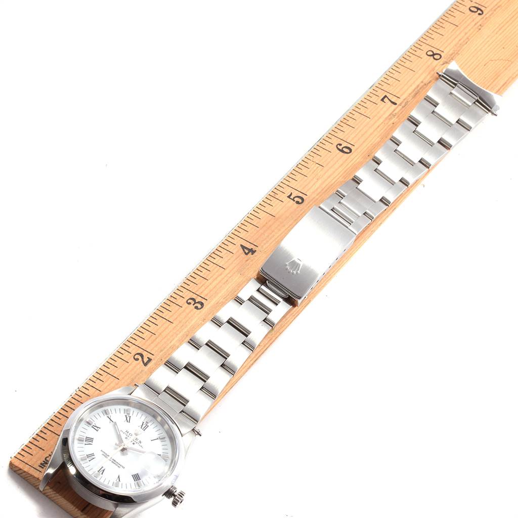 The image shows a Rolex Date 15200 Men's Stainless Steel White Dial 15200 Men's Stainless Steel White Dial model watch from a top-down angle, displaying the full face, bracelet, and clasp.