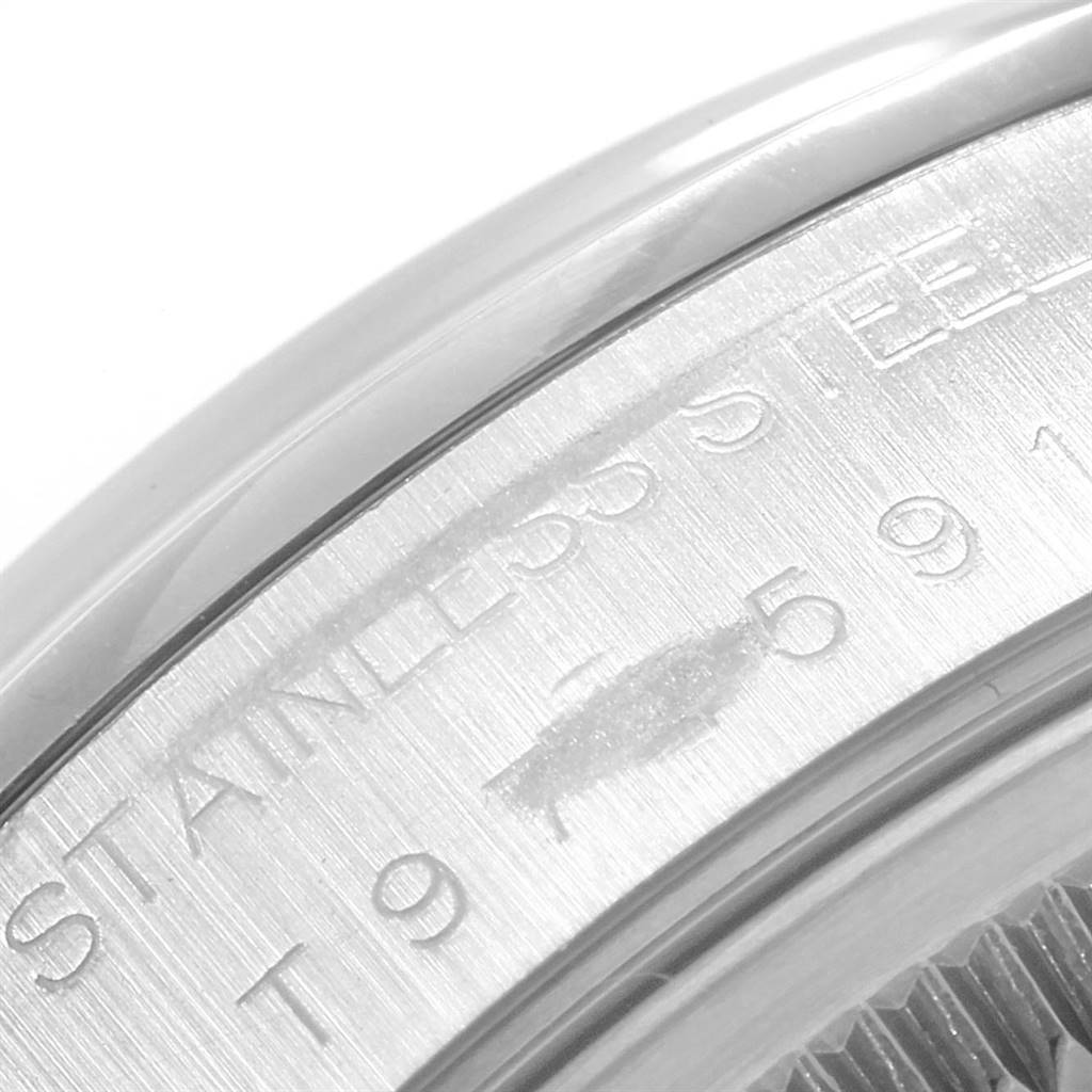 The image shows a close-up of the side of a Rolex Date 15200 Men's Stainless Steel White Dial 15200 Men's Stainless Steel White Dial model watch, highlighting the engraved text on the stainless steel case.