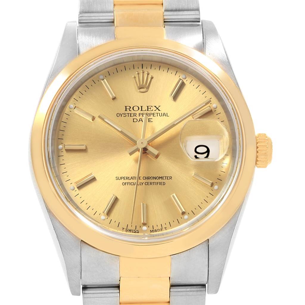 The image shows a front view of a Rolex Date 15203 Men's Steel and Gold (two tone) Champagne Dial 15203 Men's Steel and Gold (two tone) Champagne Dial model watch, highlighting its gold dial, hour markers, and date window at 3 o'clock.