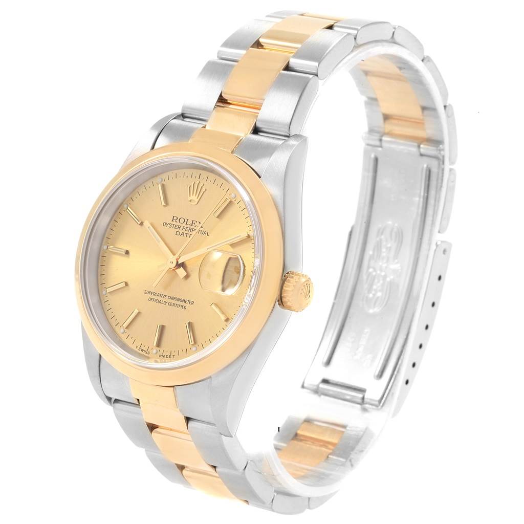 This image shows a side angle of a Rolex Date 15203 Men's Steel and Gold (two tone) Champagne Dial 15203 Men's Steel and Gold (two tone) Champagne Dial model watch, featuring its gold and silver bracelet, bezel, crown, and dial with date display.