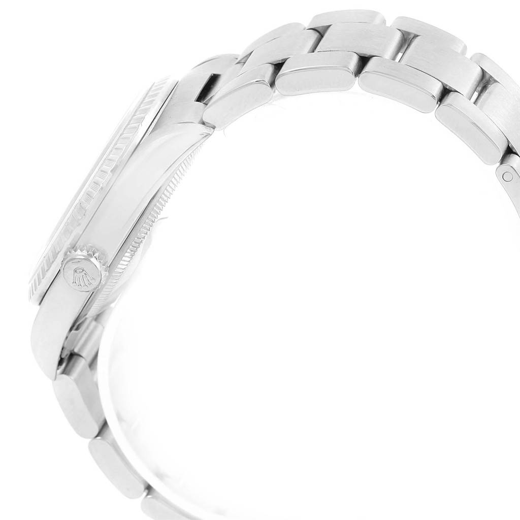 The image shows a side view of a Rolex Date 16220 Men's Stainless Steel Silver Dial 16220 Men's Stainless Steel Silver Dial watch, highlighting the crown and stainless steel bracelet.