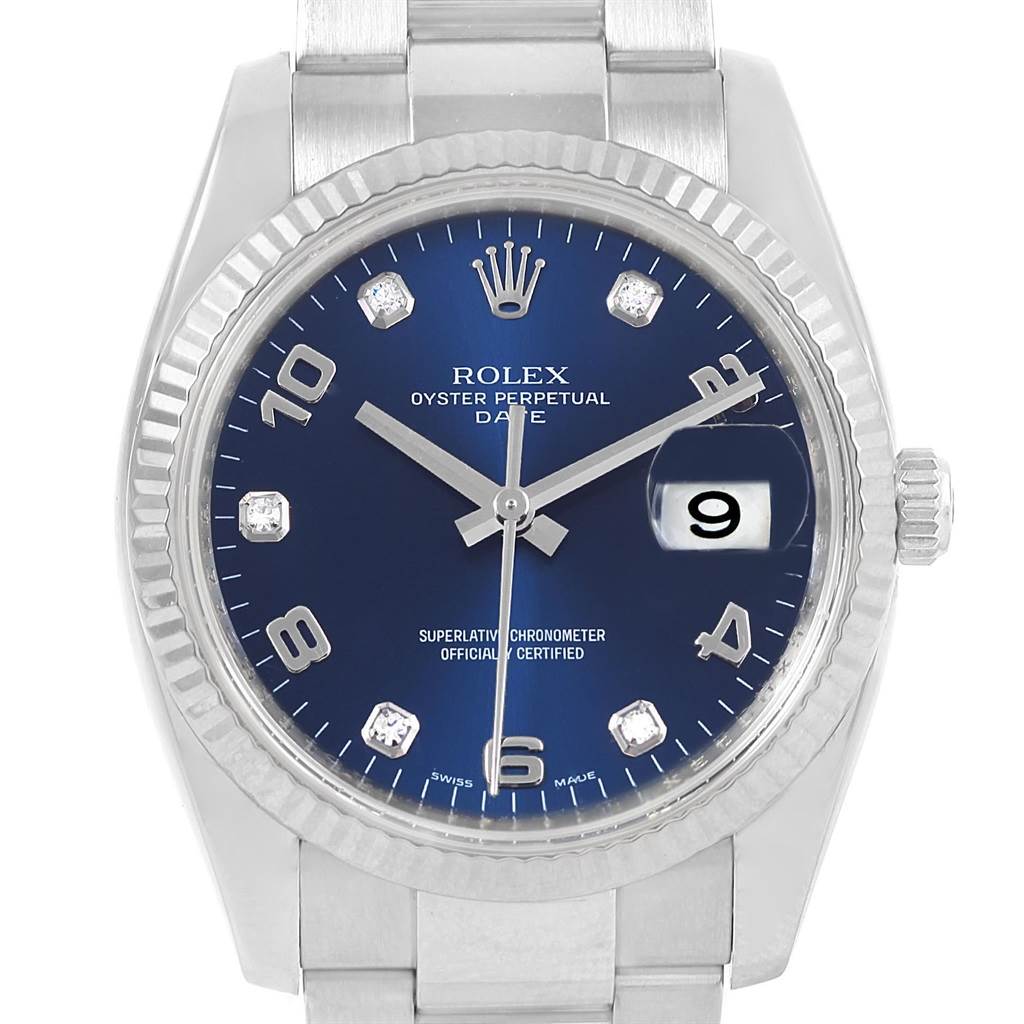 The image shows a head-on view of the Rolex Date 115234 Men's Stainless Steel Blue Dial 115234 Men's Stainless Steel Blue Dial model, displaying the dial, hour markers, hands, crown, and part of the bracelet.